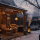 Tuin in winter met overkapping en verlichting